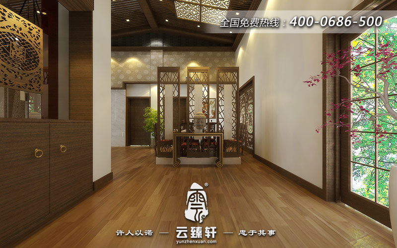 玄關(guān)選擇嚴(yán)謹(jǐn)風(fēng)格的案幾,案幾上擺放的佛像頭像